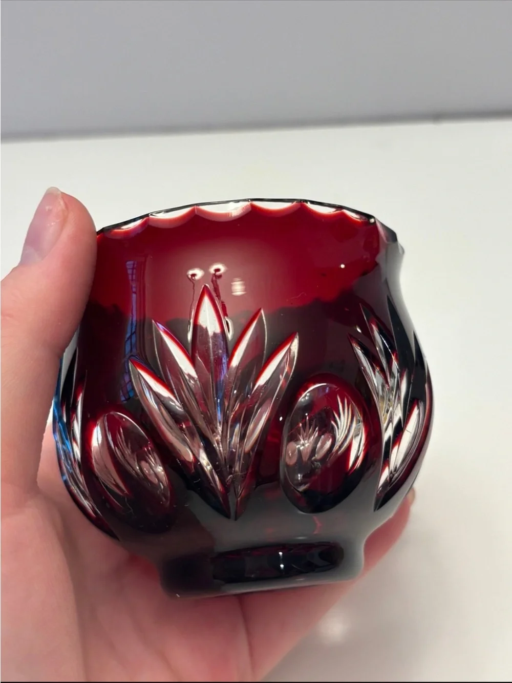 Bohemian Red Crystal glass votive candle holder features intricate cut-to-clear